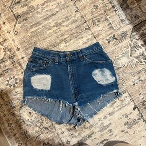 Vintage distressed Levi’s denim cutoff shorts size 28